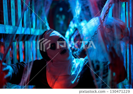 Spooky devilish nun in cage with hang death bride. 2025 Halloween 130471229