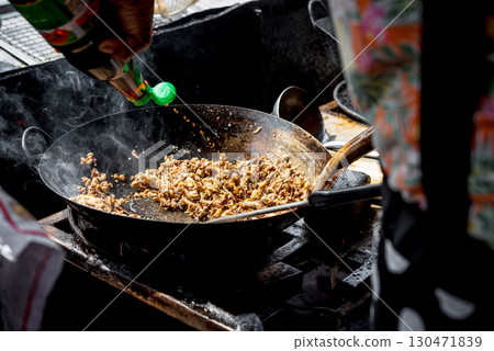 Rice topped with stir-fried pork or beef and basil Rice topped with stir-fried pork or beef and basil 130471839