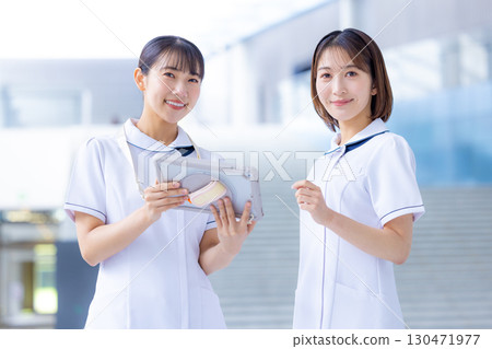 Medical nurse woman looking at tablet 130471977