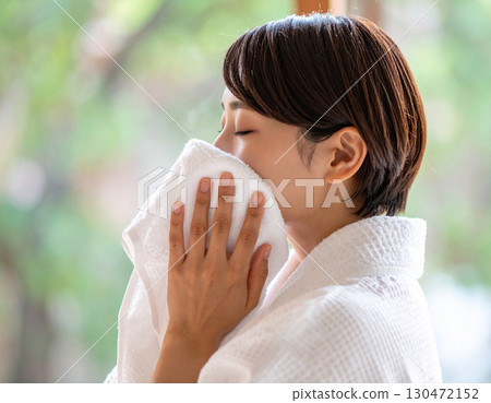 Young woman blown by sea breeze 130472152