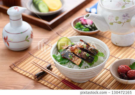 Savory mackerel chazuke: A classic Japanese dish of rice topped with grilled mackerel jerky and hot tea poured over it. 130472165