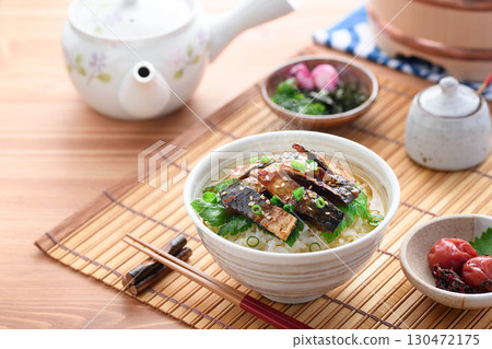 Savory mackerel chazuke: A classic Japanese dish of rice topped with grilled mackerel jerky and hot tea poured over it. 130472175