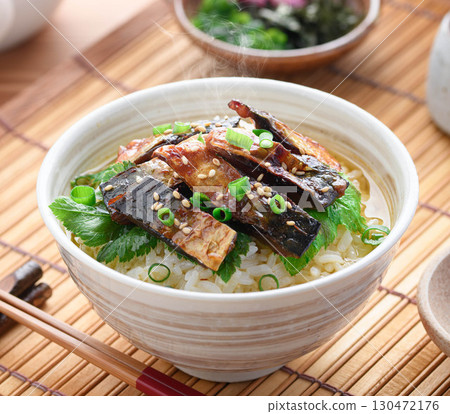 Savory mackerel chazuke: A classic Japanese dish of rice topped with grilled mackerel jerky and hot tea poured over it. Savory mackerel chazuke: A classic Japanese dish of rice topped with grilled mackerel jerky and hot tea poured over it. 130472176