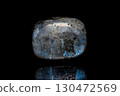 Larvikite stone on dark background 130472569
