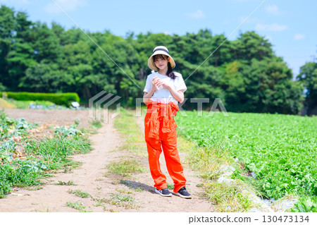 A girl hydrating on the plateau. Outdoor and health image. A girl hydrating on the plateau. Outdoor and health image. 130473134
