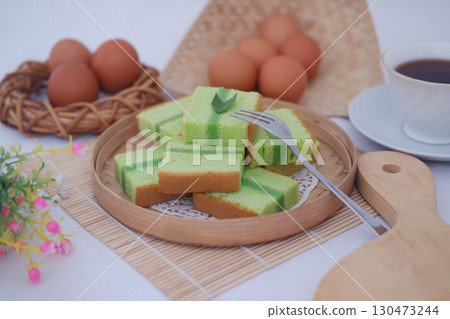 Delicious Pandan Layer Cake with Eggs and Tea 130473244