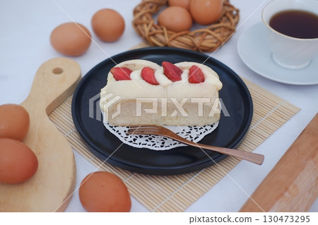 Strawberry Cream Bread on Black Plate with Eggs and Tea Strawberry Cream Bread on Black Plate with Eggs and Tea 130473295