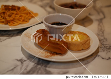 Delectable Dessert Plate with Pastries and Sauce Delectable Dessert Plate with Pastries and Sauce 130473681