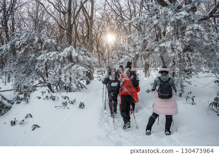 Winter hikers on snow-covered Eorimok Trail, Hallasan, Jeju Island Winter hikers on snow-covered Eorimok Trail, Hallasan, Jeju Island 130473964