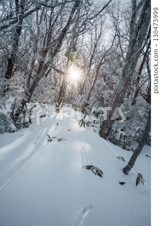 Sunlight over snowy winter forest on Eorimok Trail, Hallasan, Jeju Island Sunlight over snowy winter forest on Eorimok Trail, Hallasan, Jeju Island 130473999