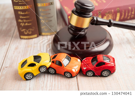 Bangkok, Thailand March 15, 2024 Car accident lawsuit and insurance, Judge hammer and money with car model. 130474041
