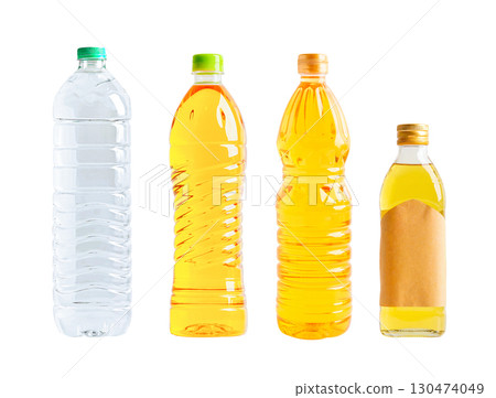 Vegetable oil and water plastic bottle isolated on white background. 130474049