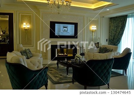 Elegant living room interior design with fireplace and tv 130474645