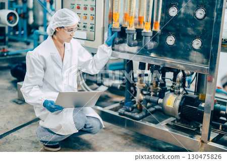 staff hand work in science medical lab factory check record pressure tank with laptop computer 130475826