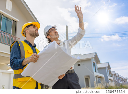 Senior Construction Engineer Project manager working, Engineer building inspection with floorplan 130475834