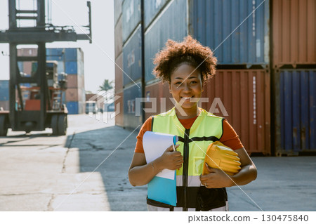 Women work container port, Customs at container yard manage,Cargo Import Export. Logistics industry. Women work container port, Customs at container yard manage,Cargo Import Export. Logistics industry. 130475840