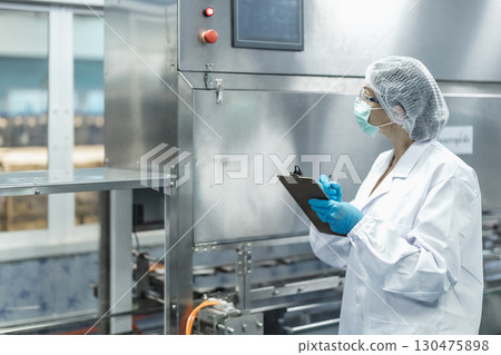 Industry inspector team working, QC staff work checking machine operation for safety and hygiene 130475898