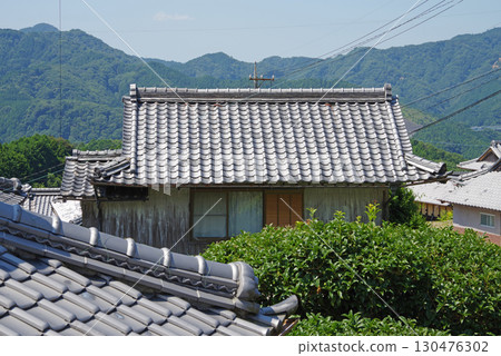Traditional rural scenery: tiled roofs of old houses (Sakamoto district, Yasusakayama town, Kameyama city, Mie prefecture) 130476302