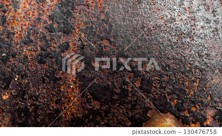 The photo of rusty black surface of metal plate with metal texture 130476758