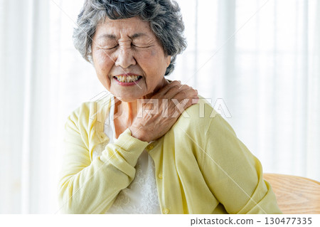 Senior woman with shoulder pain 130477335