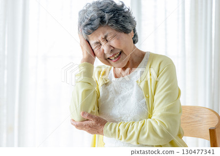 Senior woman suffering from headache Senior woman suffering from headache 130477341