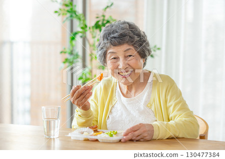 Senior woman to eat Senior woman to eat 130477384