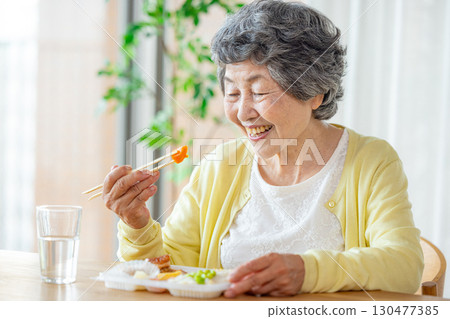Senior woman to eat Senior woman to eat 130477385