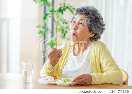 Senior woman to eat Senior woman to eat 130477386