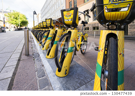 rental bicycles on a sidewalk in Helsinki, Finland rental bicycles on a sidewalk in Helsinki, Finland 130477439