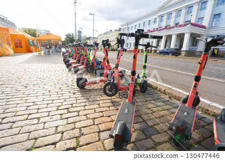 Electric scooters for rent parked in Helsinki, Finland 130477446