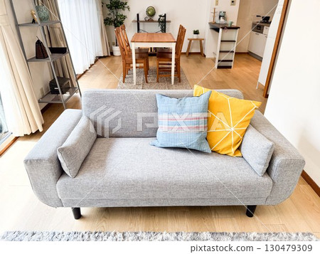 Living and dining room with sofa 130479309