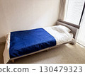 Bed by the window in the bedroom 130479323