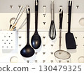 Kitchen utensils hanging on the wall 130479325