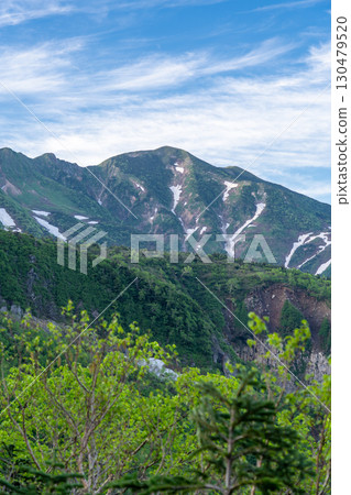 View of Mt. Betsuyama and Obyobu from the Sabo Shindo Trail. Climbing Mt. Hakusan Gozenmine in early summer (Kuroboko Rock Course) 130479520