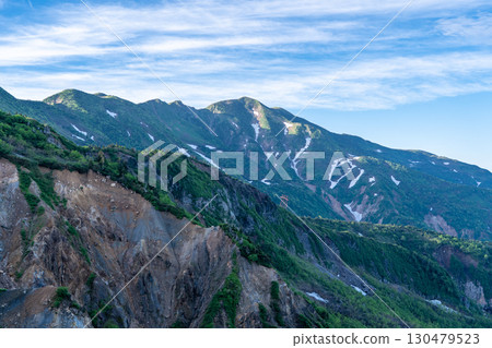 View of Mt. Betsuyama and Obyobu from the Jinnosuke refuge hut on the Sabo Shindo trail. Climbing Mt. Hakusan Gozenmine in early summer (Kuroboko Rock course) 130479523