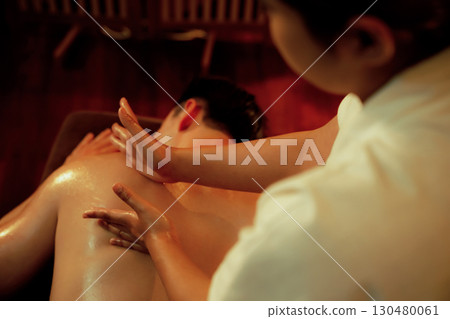 Caucasian man customer enjoying relaxing anti-stress massage. Quiescent Caucasian man customer enjoying relaxing anti-stress massage. Quiescent 130480061
