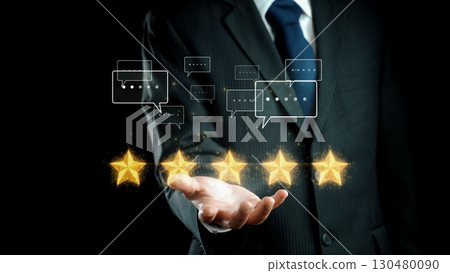 Business Professional Presenting Five Star Ratings with Customer Feedback Icons on a Dark Background for Review and Rating Concepts. Qubit 130480090