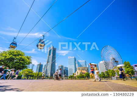 Yokohama cityscape in Japan...View of the ropeway and Yokohama Landmark Tower from Canal Park Station and Canal Park Yokohama cityscape in Japan...View of the ropeway and Yokohama Landmark Tower from Canal Park Station and Canal Park 130480229