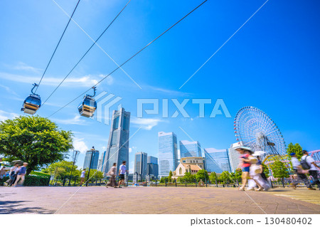 Yokohama cityscape in Japan...View of the ropeway and Yokohama Landmark Tower from Canal Park Station and Canal Park Yokohama cityscape in Japan...View of the ropeway and Yokohama Landmark Tower from Canal Park Station and Canal Park 130480402