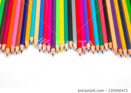 A row of vibrant colored pencils on a white background, ideal for art 130480472