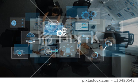 Modern Office Meeting with Digital Analytics and Data Visualization Overlays Showing Collaboration and Project Planning in a Bright Workspace. Raster 130480542