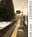 An unmanned station surrounded by snow at dusk 130480635