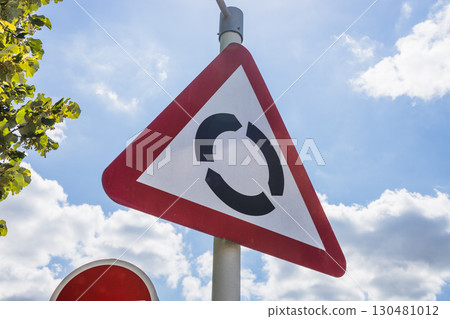 Roundabout Warning Road Sign. Traffic Safety and Navigation Roundabout Warning Road Sign. Traffic Safety and Navigation 130481012