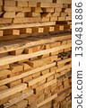 Neatly stacked wooden planks in sunlight 130481886