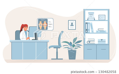 Doctor in office using computer at desk with anatomical poster on wall in medical background 130482058