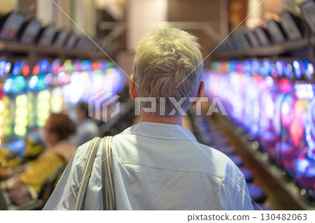 Men playing at a pachinko parlor 130482063
