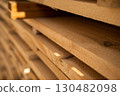 Close-up of raw wooden boards stacked at sawmill 130482098
