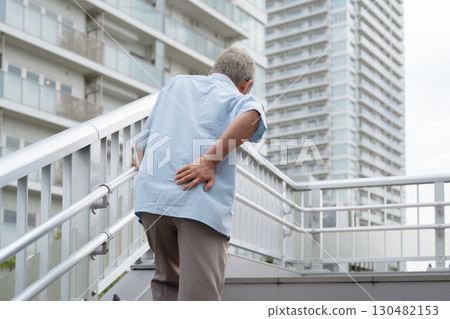 Senior man climbing the stairs 130482153