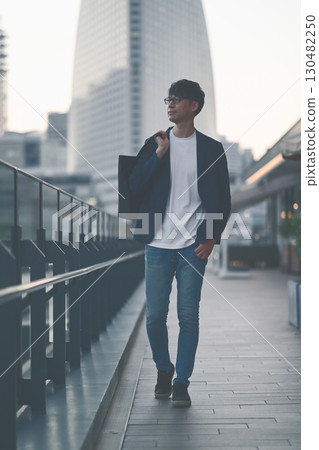 A man walking in the city A man walking in the city 130482250