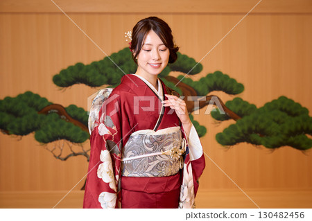 Japanese woman in furisode kimono standing on the Noh stage Japanese woman in furisode kimono standing on the Noh stage 130482456